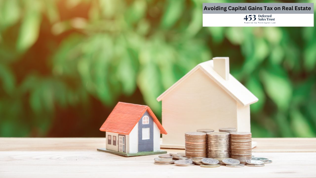 Two miniature houses sit on a wooden surface beside stacks of coins, illustrating the financial aspects of real estate.