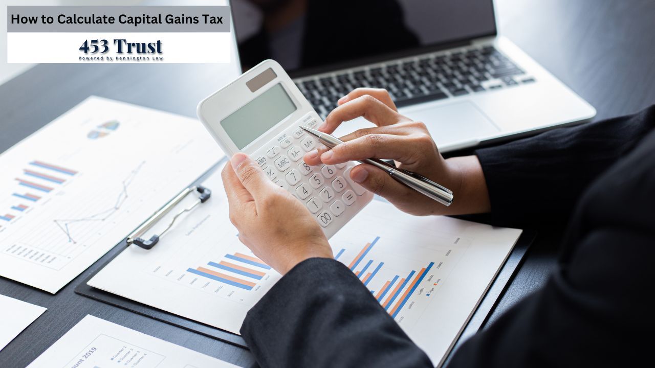 The person, wearing a dark-colored blazer, is holding a white calculator with their hands. They are focused on the calculator, their hands positioned over the number keys. A silver pen rests in their hand.